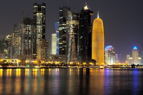 The file picture shows a night view of Qatar's evolving new skyline .