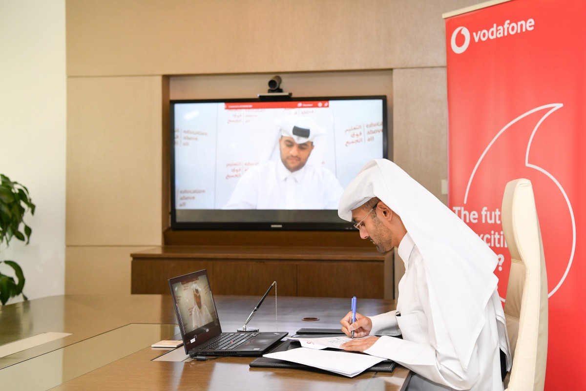 Khames Mohammed Al Naimi, Vodafone Qatar’s Chief Human Resources Officer, and EAA’s Director of Procurement and Operations, Mohammed Saad Al Kubaisi (in the screen), signing the agreement during a virtual meeting held yesterday. 