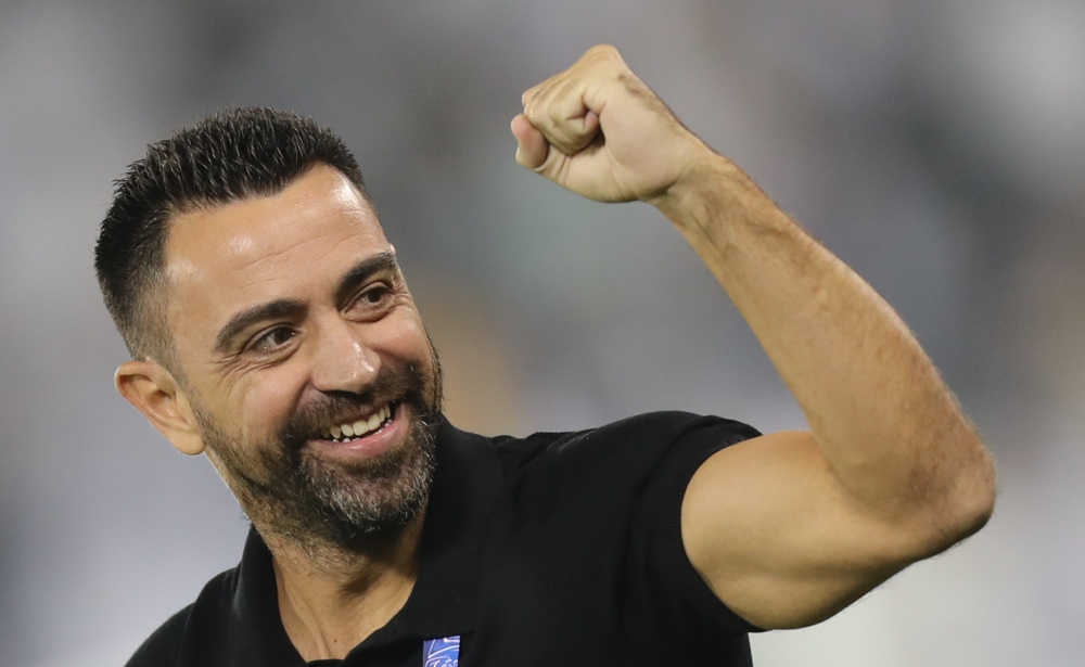 In this file photo taken on October 01, 2019, Sadd's coach Xavi Hernandez reacts after a goal during the first leg of the AFC Champions League semi-finals football match between Qatar's Al Sadd and Saudi' Al Hilal at the Jassim bin Hamad Stadium in the Qa
