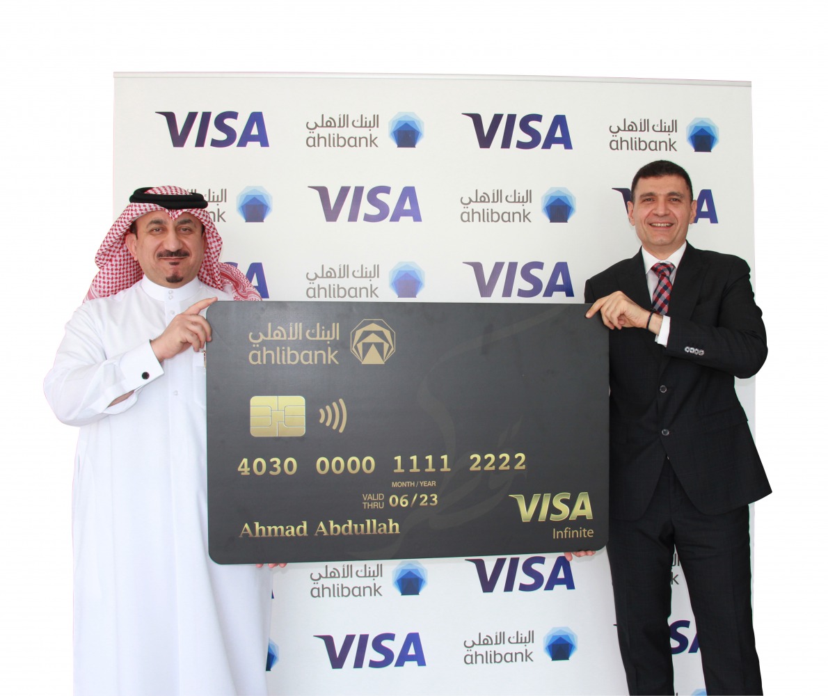 Mohamed Al Namla (left), Deputy CEO - Business Support, Services and Human Resources of Ahlibank, during the launch ceremony.