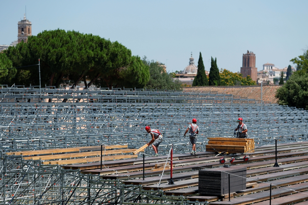 Workers build a seating area for socially distanced Rome Opera House's summer performances at Circus Maximus, the ancient chariot racetrack, following the coronavirus disease (COVID-19) outbreak in Rome, Italy, June 25, 2020. REUTERS/Guglielmo Mangiapane