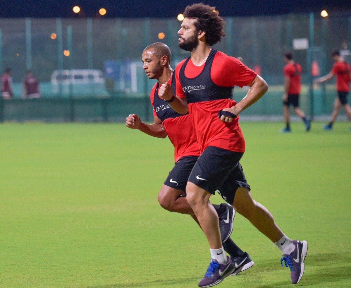 Al Rayyan's Algerian attacking midfielder Yacine Brahimi (left) and his team-mate Ahmad Abdel Maqsoud taking part in a training session ahead of the resumption of the QNB Stars League season. Pic: Twitter / @AlrayyanSC