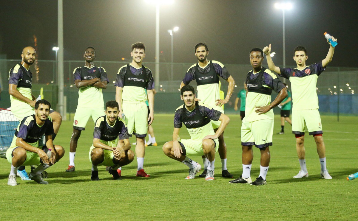 Al Duhail players posing for a photograph during a training session at the club's training pitch yesterday.