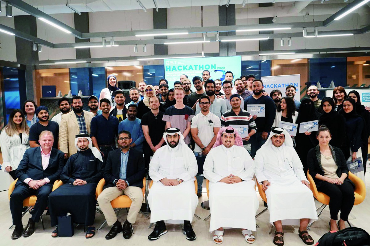 A file photo of officials and participants of Qatar SportsTech during its Hackathon contest in February. 