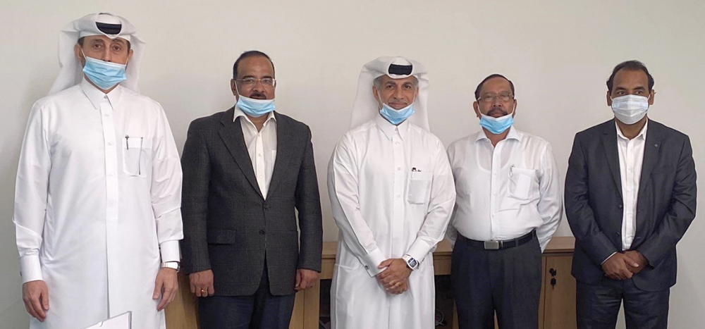 Senior officials of Al Ahed Holding pose for a photo in Doha, recently.