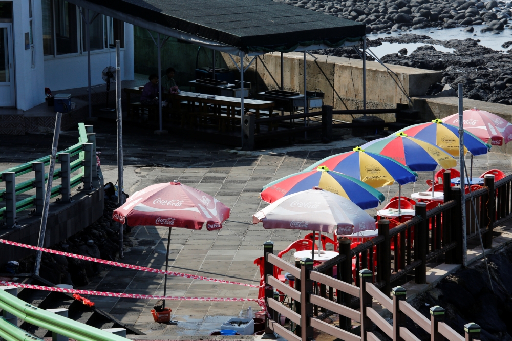 A shop that has been closed temporarily is seen amid the coronavirus disease (COVID-19) outbreak on Jeju island, South Korea, August 28, 2020. REUTERS/Heo Ran
