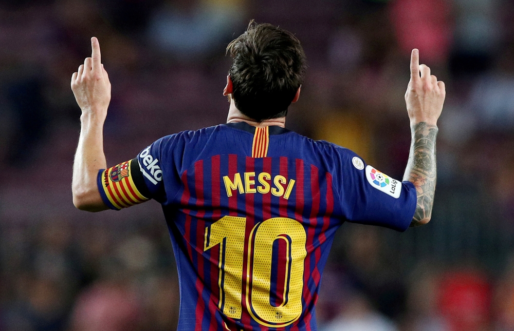 Barcelona's Lionel Messi celebrates scoring their third goal REUTERS/Albert Gea/File Photo