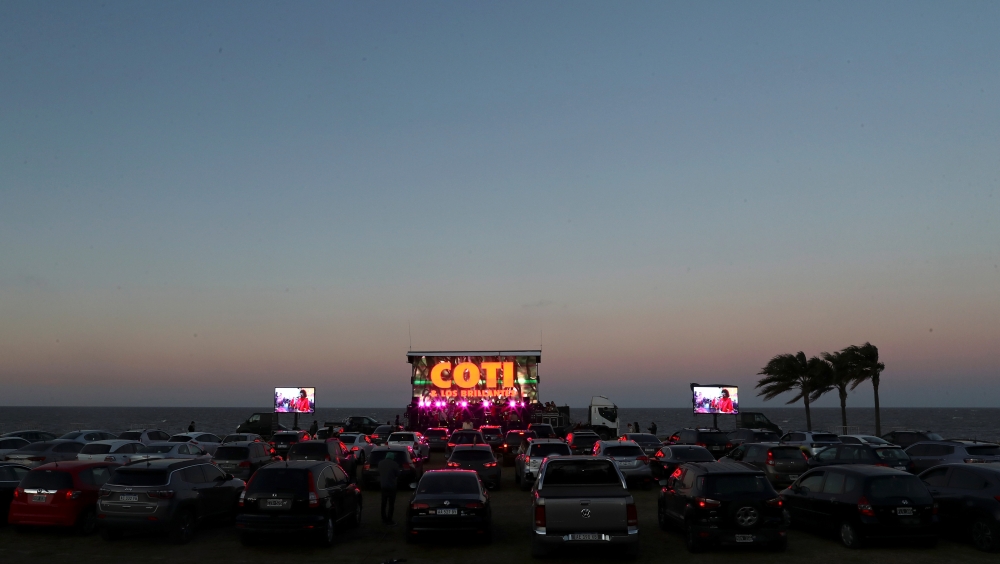 People enjoy a drive-in concert by local pop band Coti y Los Brillantes, amid the coronavirus disease (COVID-19) outbreak in Buenos Aires, Argentina September 5, 2020. Picture taken September 5, 2020. REUTERS/Agustin Marcarian