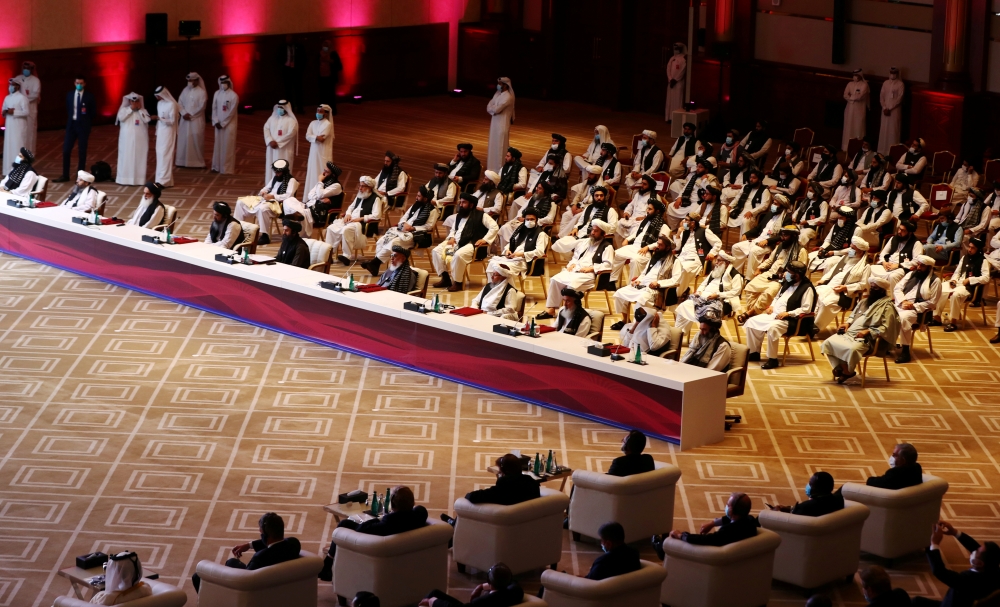 File photo: Delegates attend talks between the Afghan government and Taliban insurgents in Doha, Qatar September 12, 2020. REUTERS/Ibraheem al Omari/File Photo