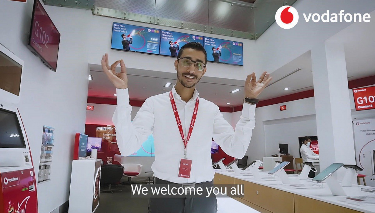 A Vodafone staff showing sign language.