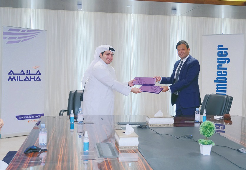 Senior officials from Milaha and Schlumberger Limited exchanging documents during the MoU signing ceremony held in Doha recently.