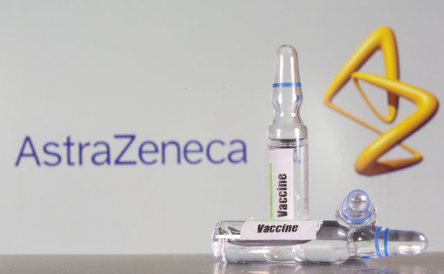 FILE PHOTO: A test tube labelled with the Vaccine is seen in front of AstraZeneca logo in this illustration taken, September 9, 2020. REUTERS/Dado Ruvic/File Photo
