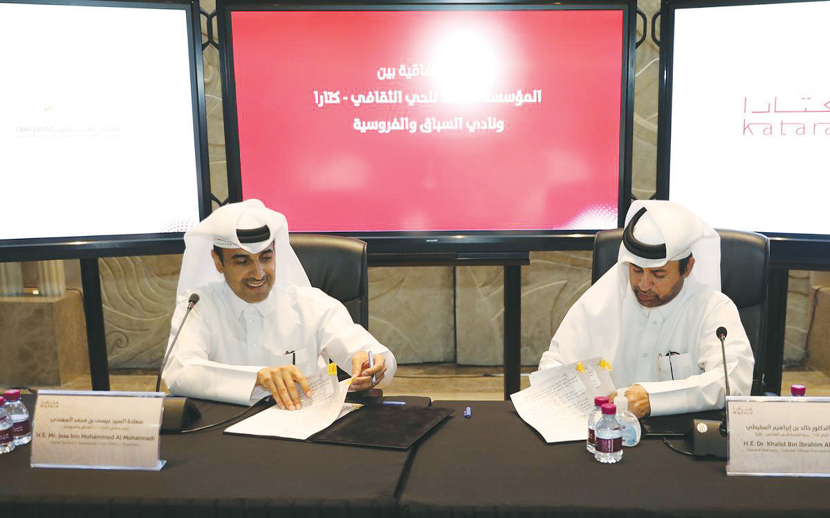 The Chairman of the Qatar Racing and Equestrian Club, Issa bin Muhammad Al Mohannadi (left) and the General Manager of the Cultural Village Katara, Dr. Khalid bin Ibrahim Al Sulaiti, signing the agreement documents during a ceremony held in Doha, yesterda
