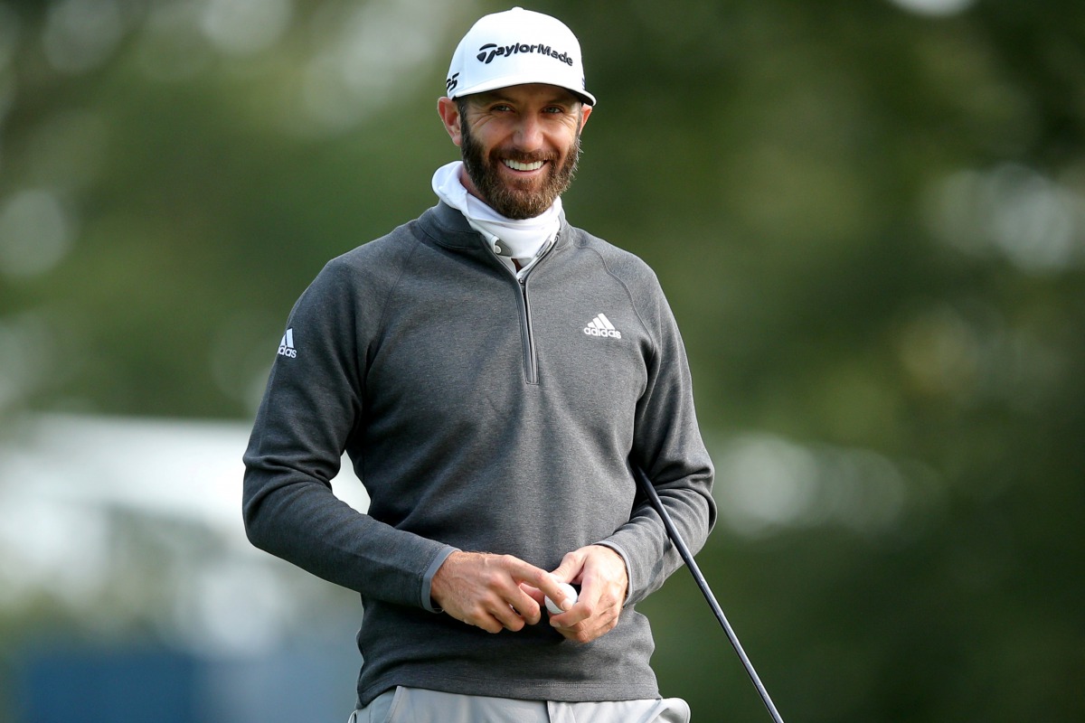 FILE PHOTO: Sep 15, 2020; Mamaroneck, New York, USA; Dustin Johnson smiles on the eleventh green during a practice round for the 2020 U.S. Open golf tournament at Winged Foot Golf Club - West. Mandatory Credit: Brad Penner-USA TODAY Sports/File Photo
