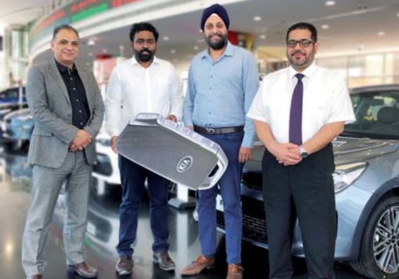 A provided picture of Point Junction Head of Operations (MENA), Harvinder Sahni and the KIA Qatar fleet sales team led by Mohammed Jassim and Mohammed Azmi, and others.