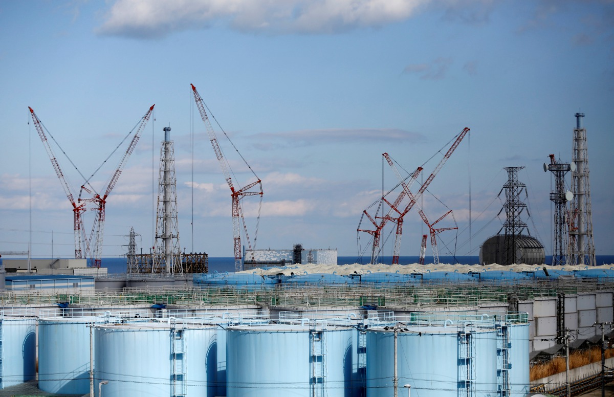 FILE PHOTO: The reactor units No.1 to 4 are seen over storage tanks for radioactive water at Tokyo Electric Power Co's (TEPCO) tsunami-crippled Fukushima Daiichi nuclear power plant in Okuma town, Fukushima prefecture, Japan February 18, 2019. REUTERS/Iss