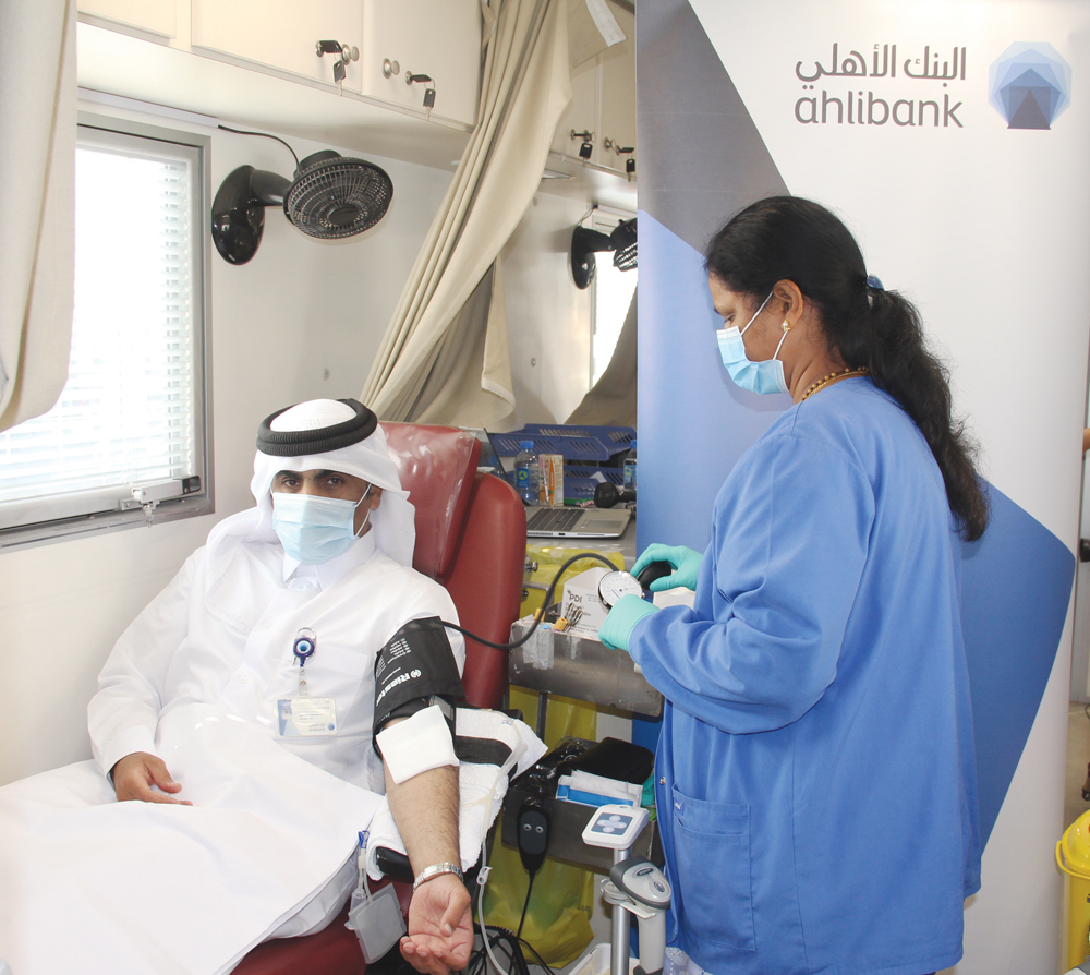 An Ahlibank official during the blood donation campaign in Doha recently. 