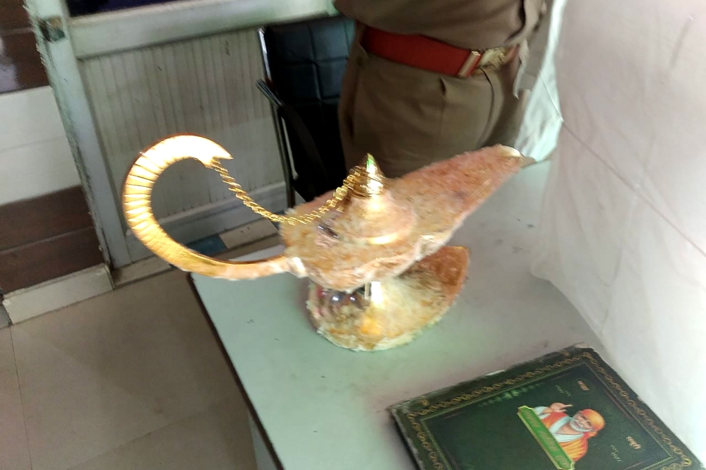 This handout photograph taken on October 29, 2020 and released by the Uttar Pradesh Police (UP Police) shows a lamp which was allegedly sold for $93,000 with the claim that it had magic powers as described in the popular folk tale 