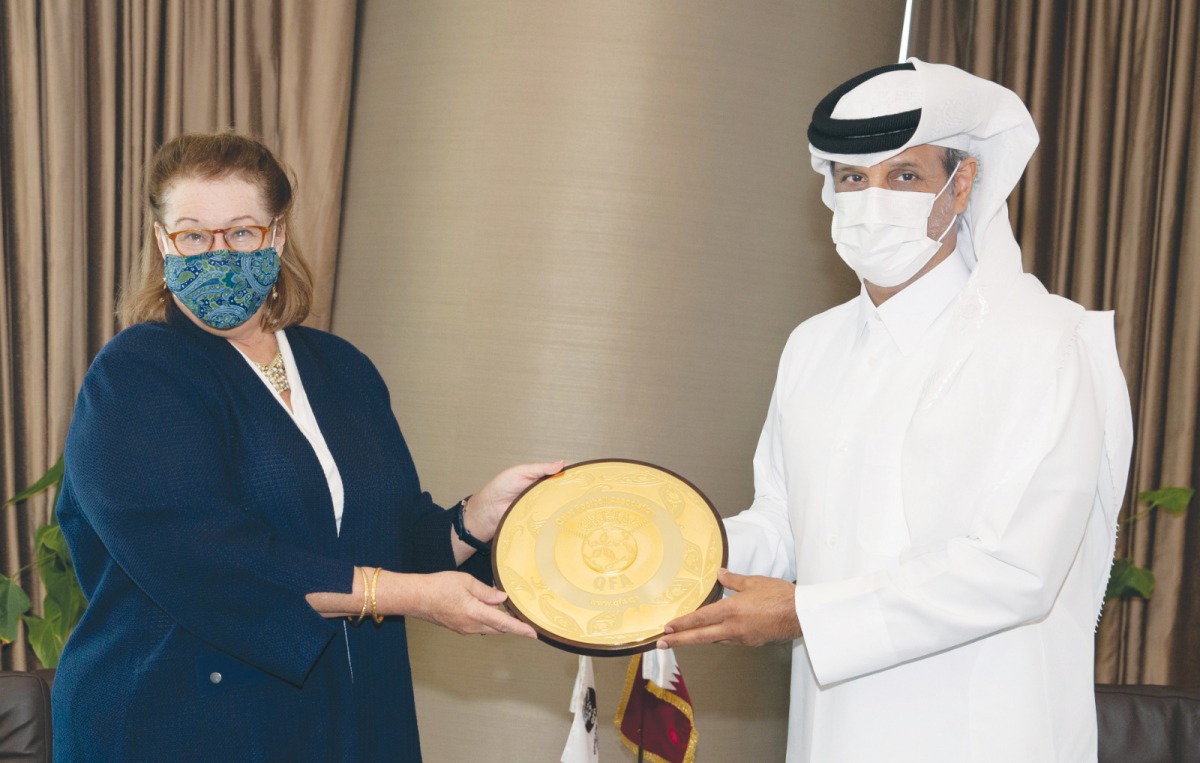 The President of the Qatar Football Association (QFA), Sheikh Hamad bin Khalifa bin Ahmed Al Thani, presenting a memento to Chargé d’Affaires of the US embassy in Doha, Ambassador H E Greta C Holtz, during a meeting in Doha yesterday.