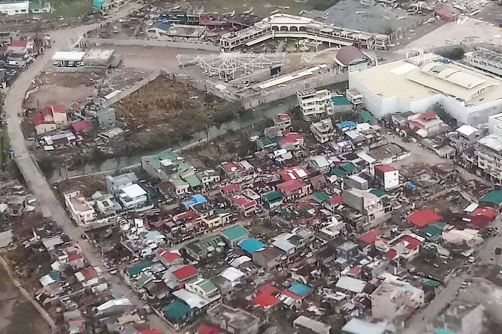 This handout photo taken and received from the Philippine Coast Guard on November 2, 2020 shows an aerial view of damaged buildings on the island province of Catanduanes, in the aftermath of Typhoon Goni. / AFP