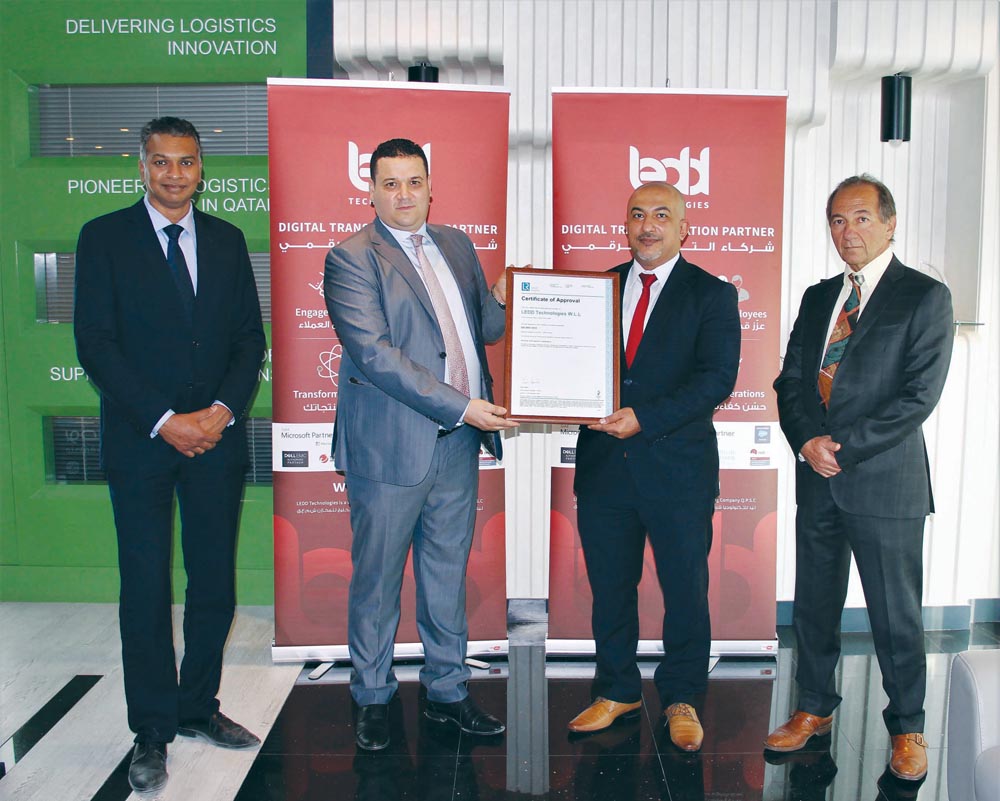 Officials receiving the ISO 9001:2015 certificate.