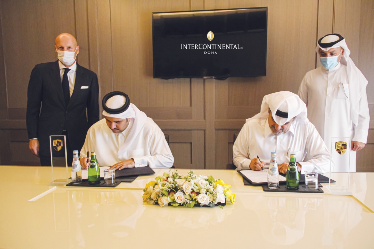 Senior officials of InterContinental Doha and Porsche Centre Doha during the signing ceremony. 