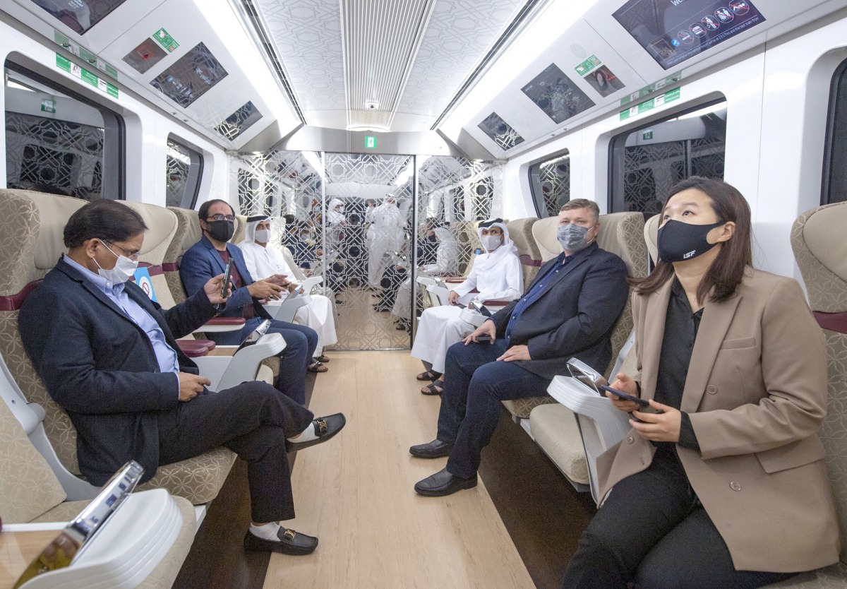 The Olympic Council of Asia Evaluation Committee members and officials taking a ride in Doha Metro.