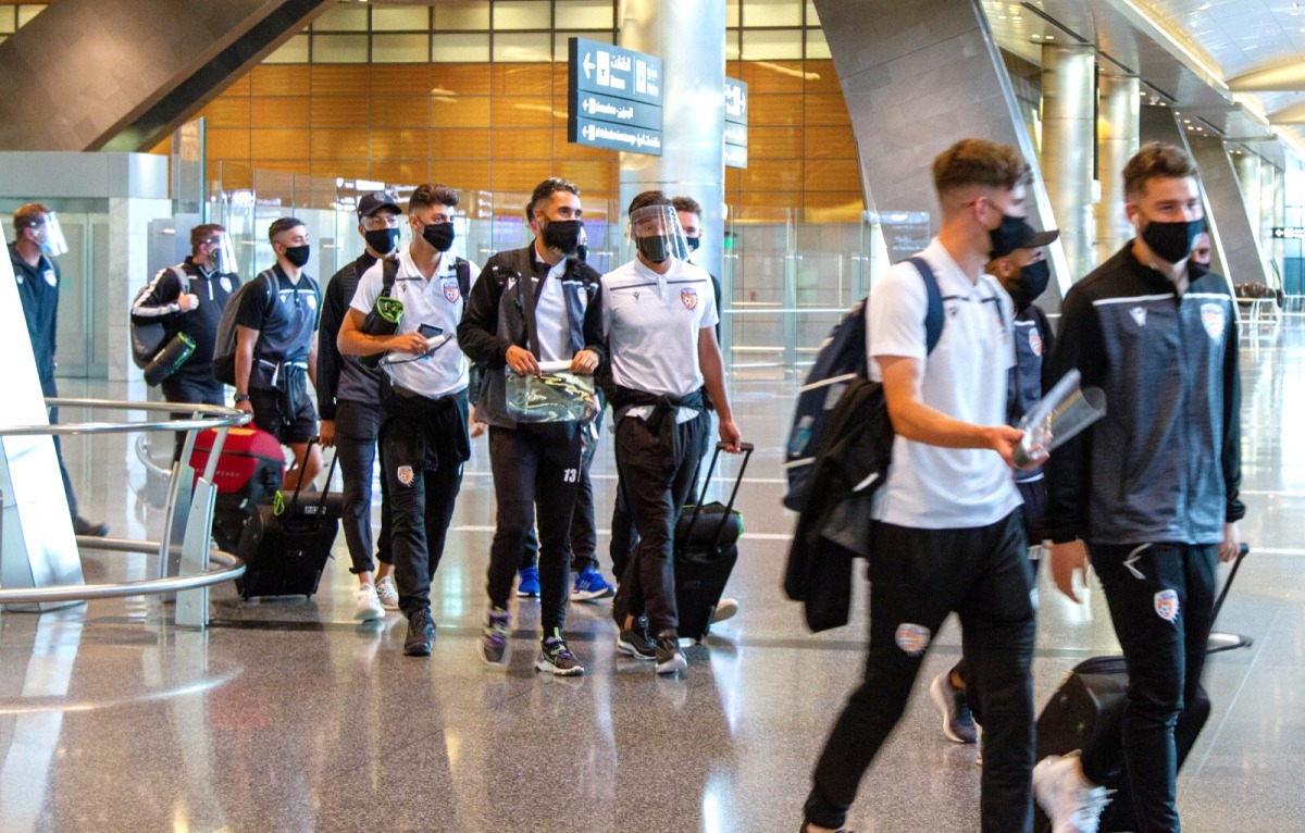 Perth Glory players arrive at the Hamad International Airport to take part in the AFC East Zone Champions League.  