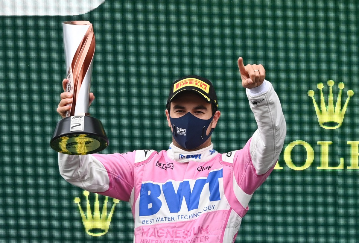 Formula One F1 - Turkish Grand Prix - Istanbul Park, Istanbul, Turkey - November 15, 2020 Racing Point's Sergio Perez celebrates on the podium with a trophy after finishing the race in second place Pool via REUTERS/Ozan Kose
