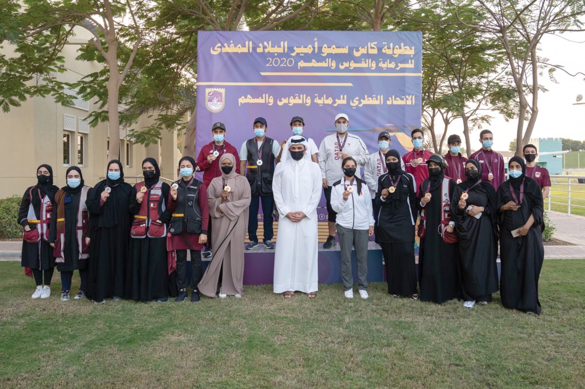 The Chairman of Qatar Olympic Committee, H E Sheikh Joaan bin Hamad Al Thani, posing for a photograph with the medal winners during the Amir Cup 2020 Shooting and Archery Championships at the Lusail Shooting Complex, yesterday. 