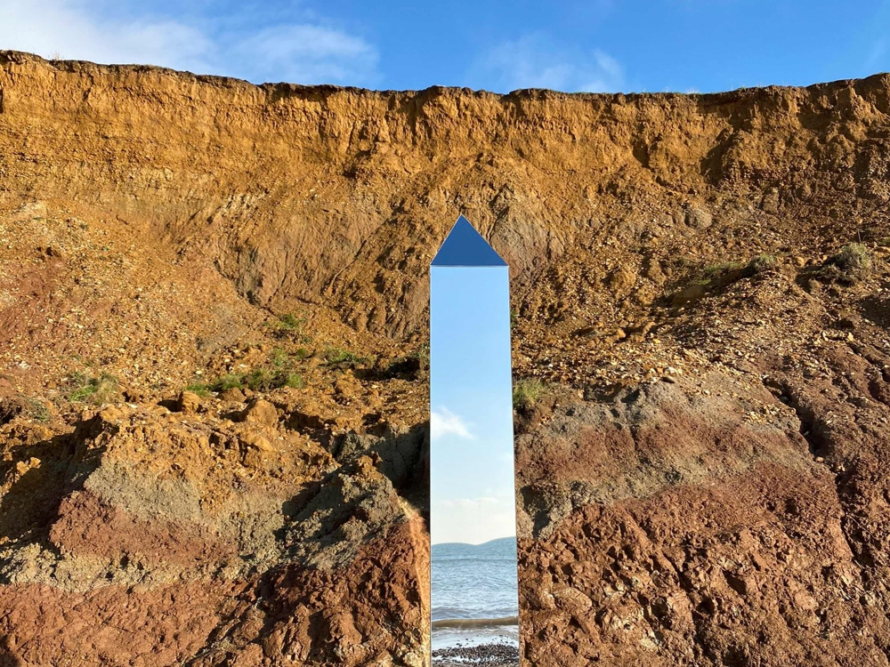 A handout picture released courtesy of the Twitter feed of @AlexiaRFishwick shows an obelisk standing on Compton Beach on the southern western coast of the Isle of Wight on December 6, 2020. AFP / @AlexiaRFishwick  
