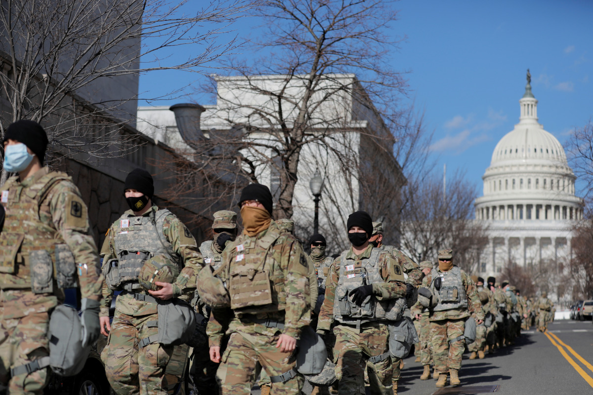 Members of the National Guard patrol near the U.S. Capitol building ahead of U.S. President-elect Joe Biden's inauguration, in Washington, U.S., January 19, 2021. REUTERS/Andrew Kelly
