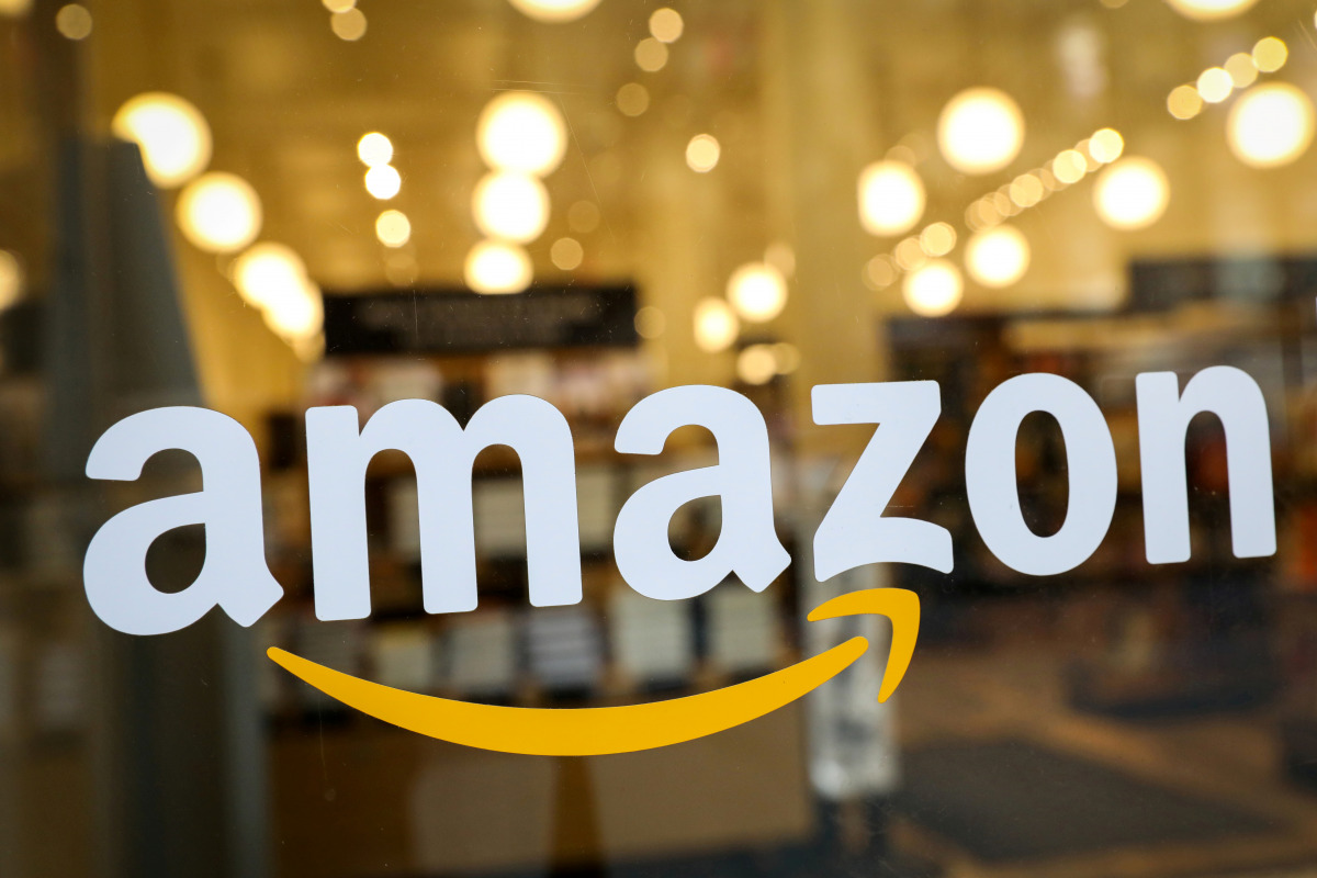 FILE PHOTO: FILE PHOTO: The logo of Amazon is seen on the door of an Amazon Books retail store in New York City, U.S., February 14, 2019. REUTERS/Brendan McDermid/File Photo
