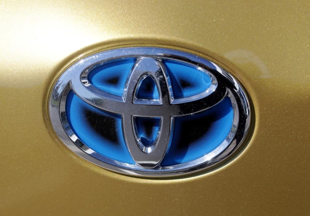 The logo of Toyota carmaker is seen on a car in Nice, France, April 8, 2019. REUTERS/Eric Gaillard/File Photo