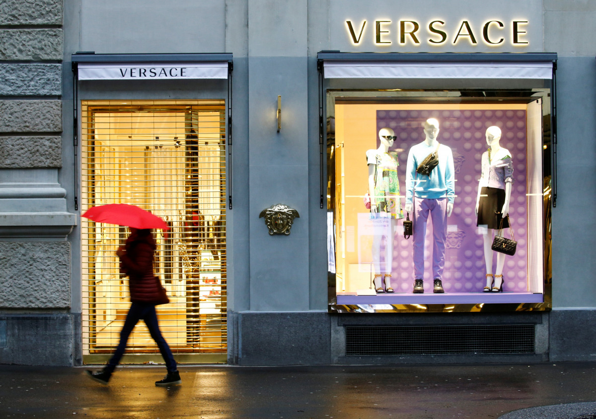 A pedestrian walks past a closed store of the Italian fashion house Versace at the Bahnhofstrasse shopping street in Zurich, during a partial lockdown as the spread of the coronavirus disease (COVID-19) continues in Switzerland February 3, 2021. REUTERS/A