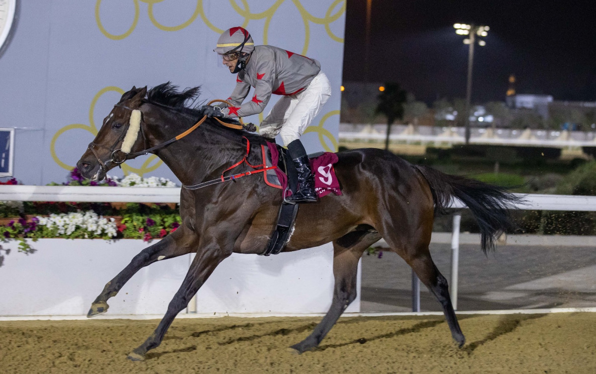 Zarandi, winner of Al Wajba Cup, crosses the finish line with jockey Ronan Thomas in the saddle.