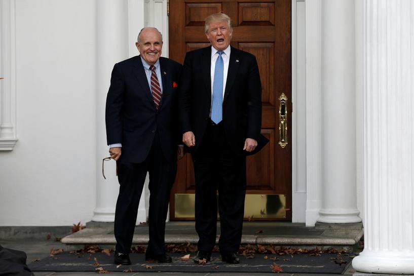 FILE PHOTO: U.S. President-elect Donald Trump stands with former New York City Mayor Rudolph Giuliani before their meeting at Trump National Golf Club in Bedminster, New Jersey, U.S., November 20, 2016. REUTERS/Mike Segar
