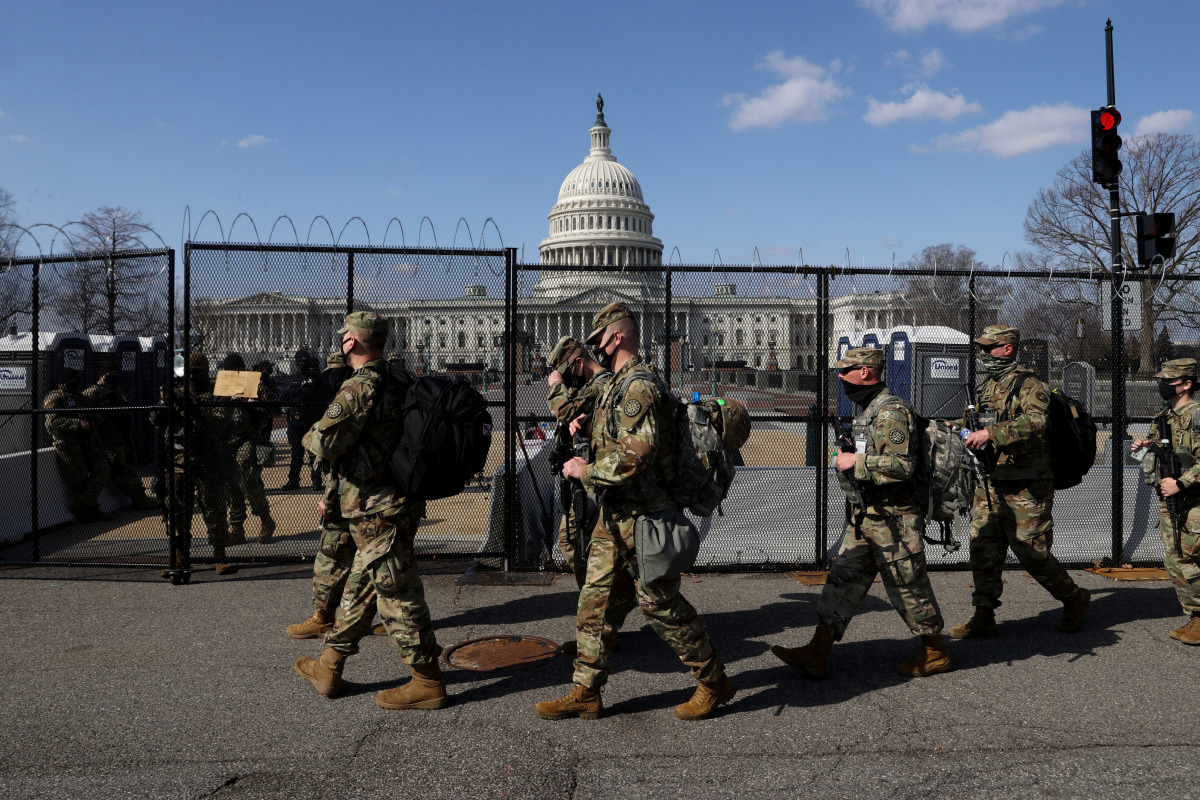 National Guard soldiers patrol the grounds of the U.S. Capitol after police warned that a militia group might try to attack the Capitol complex in Washington, U.S. March 4, 2021. REUTERS/Jonathan Ernst
