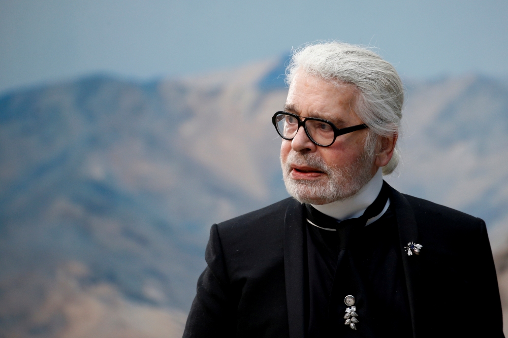German designer Karl Lagerfeld appears at the end of his Spring/Summer 2019 women's ready-to-wear collection show for fashion house Chanel during Paris Fashion Week in Paris, France, October 2, 2018. REUTERS/Stephane Mahe/File Photo