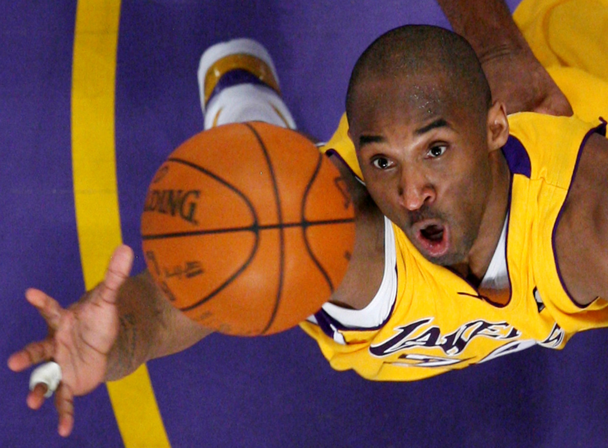 FILE PHOTO: Los Angeles Lakers Kobe Bryant jumps for a rebound against the Denver Nuggets during Game 2 of their NBA Western Conference final basketball playoff game in Los Angeles, California, U.S. May 21, 2009. REUTERS/Lucy Nicholson/File Photo
