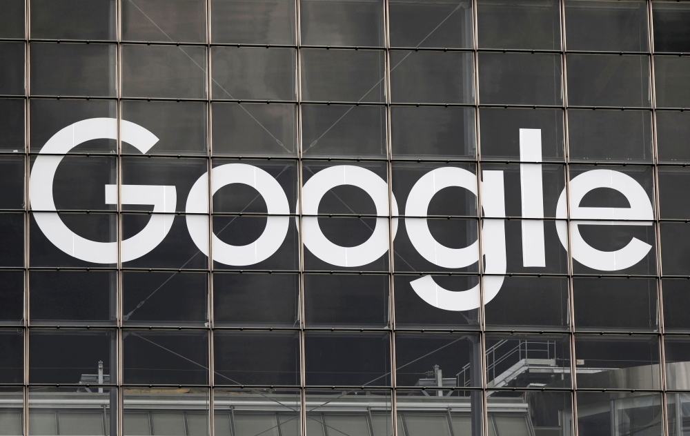 The logo of Google is seen on a building at La Defense business and financial district in Courbevoie near Paris, France, September 1, 2020. REUTERS/Charles Platiau/File Photo