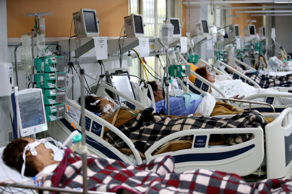 FILE PHOTO: Patients are pictured in the emergency room of the Nossa Senhora da Conceicao hospital that is overcrowding because of the coronavirus outbreak, in Porto Alegre, Brazil, March 11, 2021.  REUTERS/Diego Vara/File Photo
