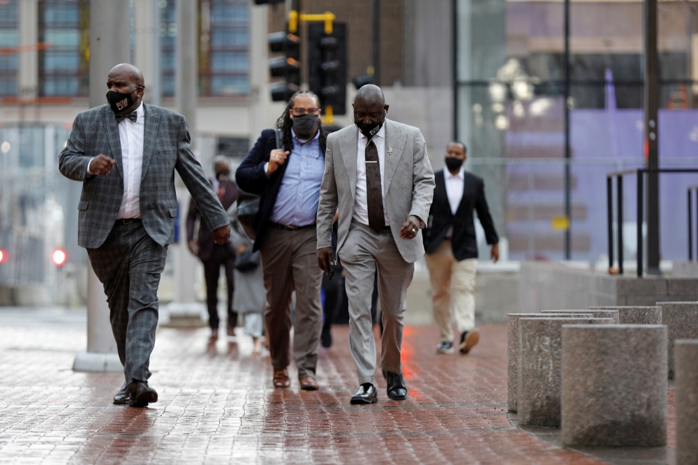 Floyd family lawyer Ben Crump and members of the Floyd family walking outside the Hennepin County Government Center on the seventh day in the trial of former police officer Derek Chauvin, who is facing murder charges in the death of George Floyd, in Minne