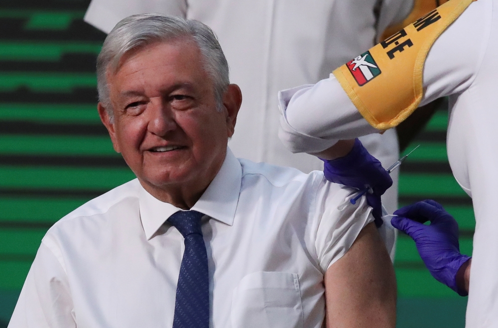 Mexico's President Andres Manuel Lopez Obrador receives a dose of the AstraZeneca coronavirus disease (COVID-19) vaccine during a vaccination at the National Palace in Mexico City, Mexico April 20, 2021. REUTERS/Henry Romero