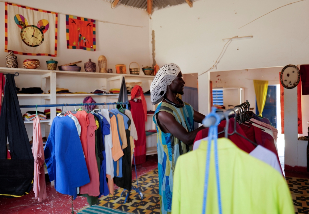 Babacar Kor, 30, from a Baye Fall community, a branch of the Muslim Mouride brotherhood, is pictured at their shop in Ndem village, Senegal April 6, 2021. Reuters/Zohra Bensemra