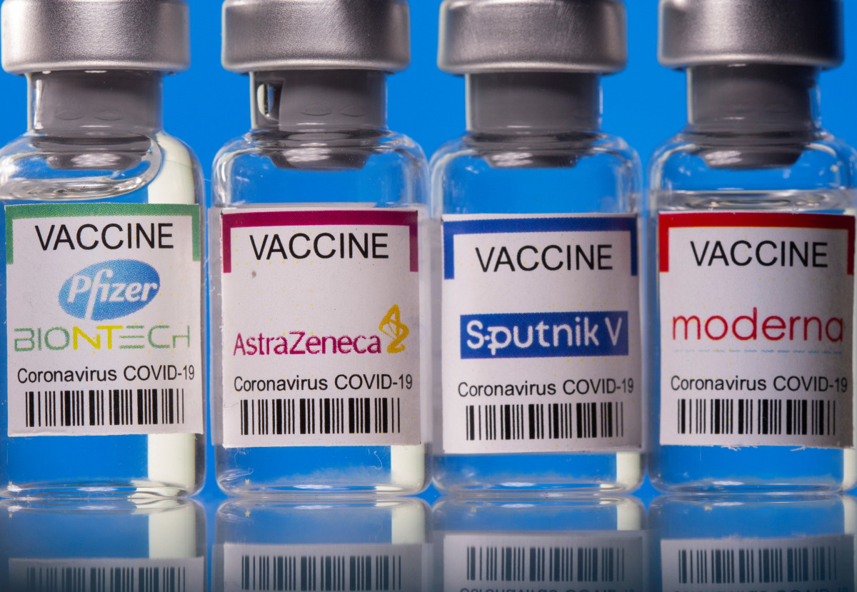 FILE PHOTO: Vials with Pfizer-BioNTech, AstraZeneca, Sputnik V, and Moderna coronavirus disease (COVID-19) vaccine labels are seen in this illustration picture taken March 19, 2021. REUTERS/Dado Ruvic/Illustration/File Photo

