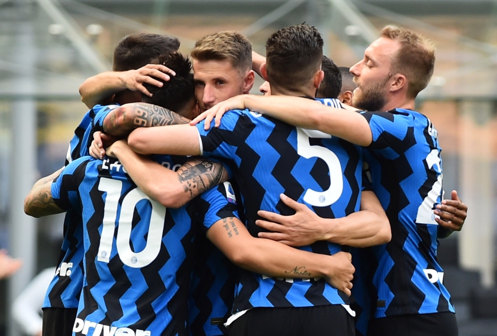Inter Milan's Lautaro Martinez celebrates scoring their third goal with teammates REUTERS/Massimo Pinca