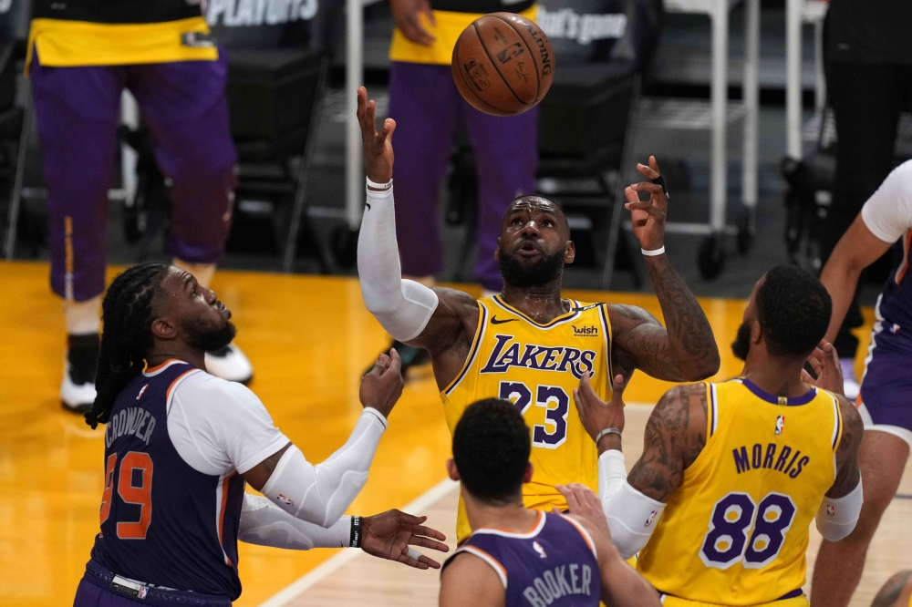 Los Angeles Lakers forward LeBron James (23) and Phoenix Suns forward Jae Crowder (99) battle for the ball in the second half during game six in the first round of the 2021 NBA Playoffs at Staples Center. Mandatory Credit: Kirby Lee-USA TODAY Sports