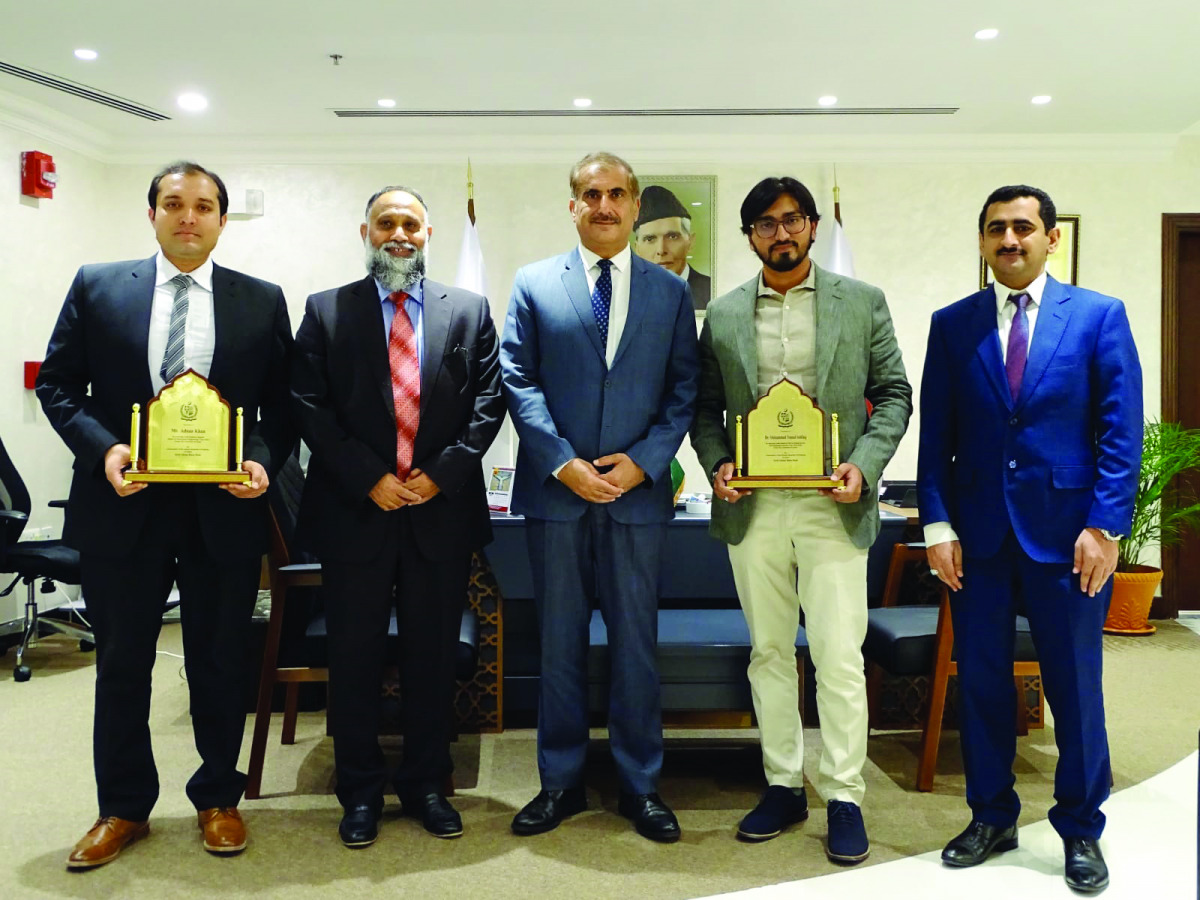 Ambassador of Pakistan to Qatar, H E Syed Ahsan Raza Shah (centre), with the QU graduates and guests.