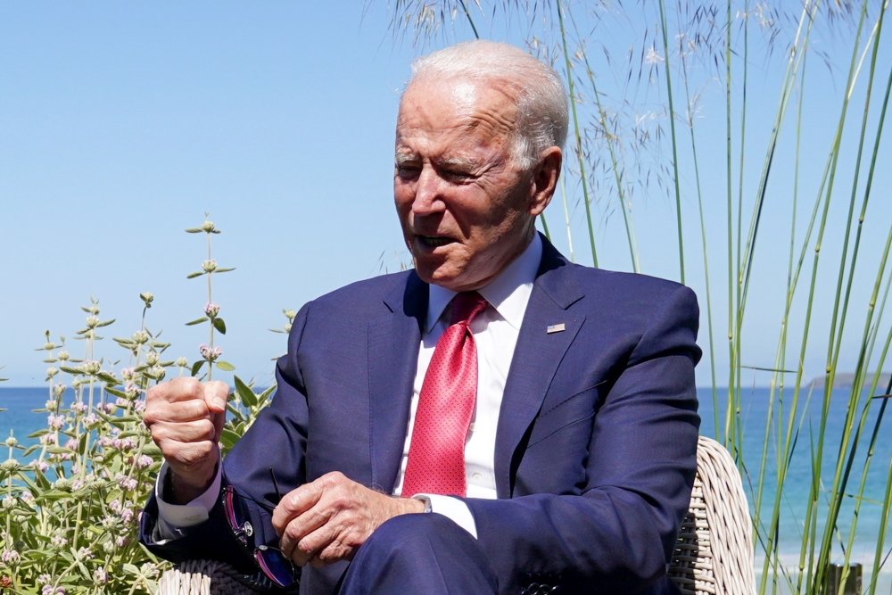 U.S. President Joe Biden reacts during a bilateral meeting with France's President Emmanuel Macron during the G7 summit in Carbis Bay, Cornwall, Britain, June 12, 2021. REUTERS/Kevin Lamarque